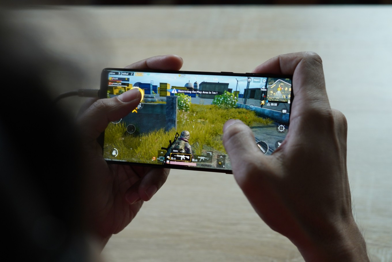 Smartphone displaying a fictional game during a SiegeHeroesCrown Australian gaming technology exhibition