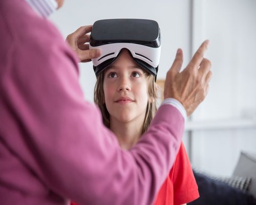 Family engaging with interactive technology